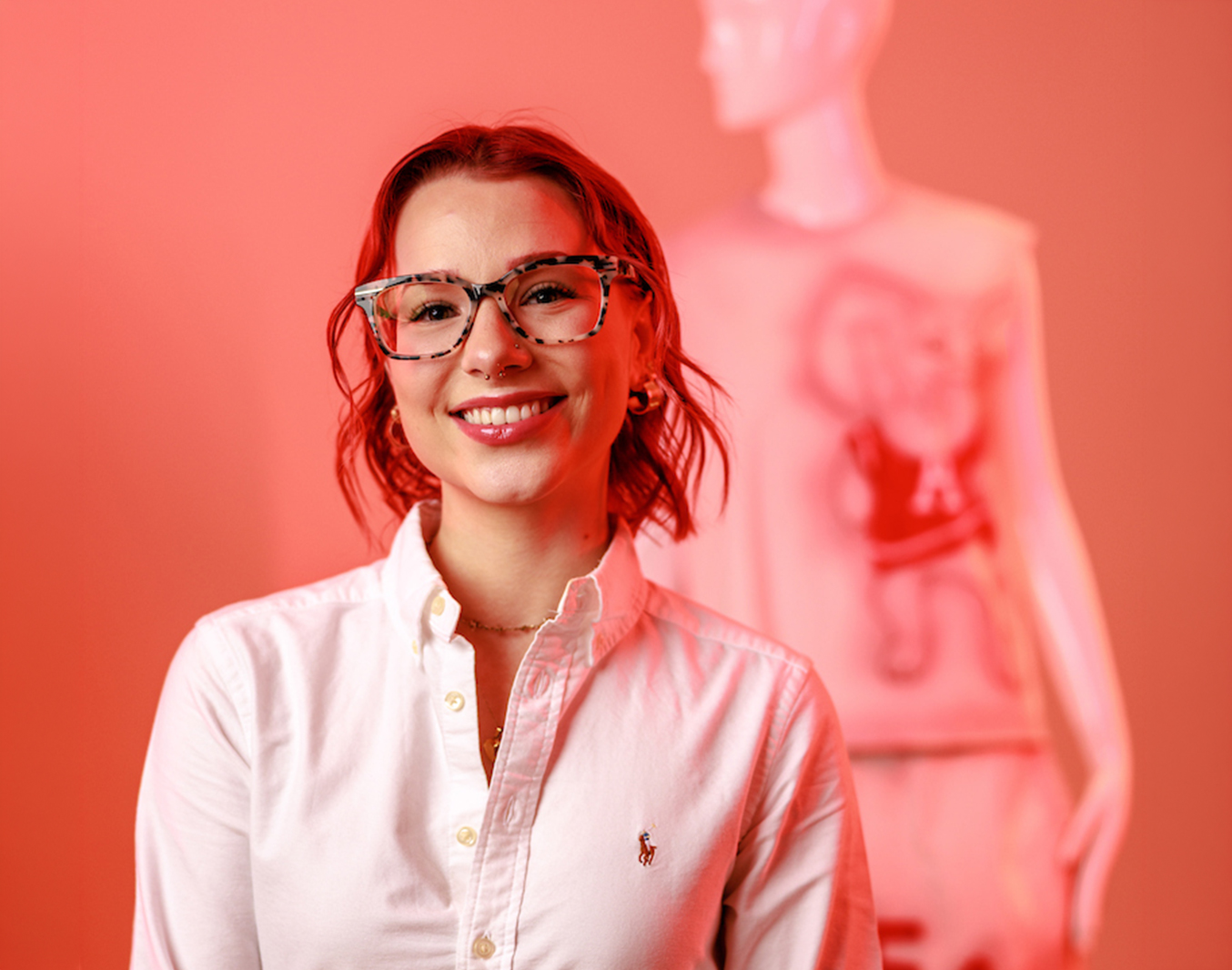 UA fashion student poses with a mannequin